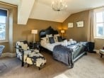 Black bedroom with chaise longue Black bedroom with chaise longue